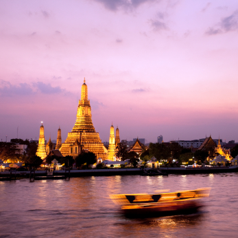 Wat Arun across Chao Phraya River during sunset